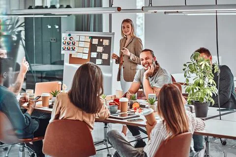 Young marketing experts collaborating while creating advertising campaign for Stock Photos
