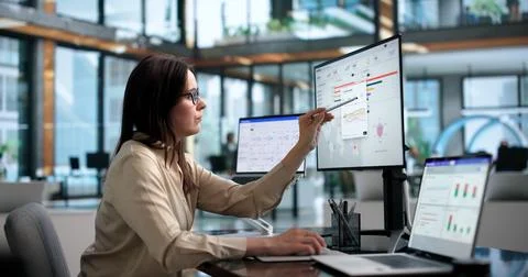 Young Marketing Manager Uses Software Dashboard On Laptop For Campaign Optimi Stock Photos