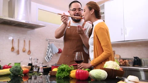 Young married couple cooking together. Stock Footage 134381453