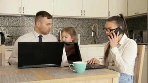 Young married couple is forced to work at home due to quarantine. Little Stock Footage 128446727