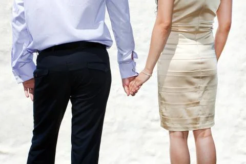 Young married couple holding hands Stock Photos