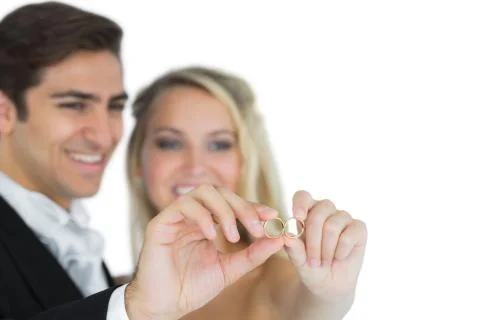 Young married couple showing their wedding rings Stock Photos