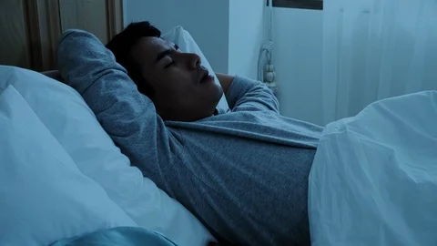 The young married sleeping on bed at night Video stock 86719605