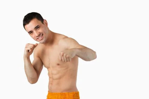 Young martial arts fighter doing left hook Stock Photos