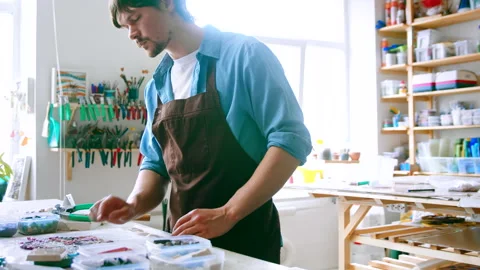 Young master in uniform in a workshop Stock Footage 157222531