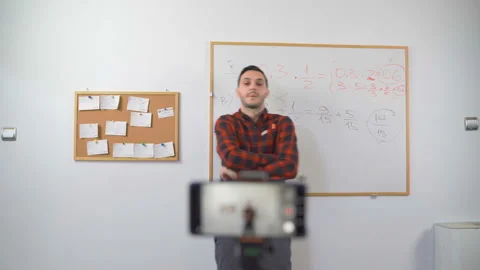 Young Math Teacher ending his online e-class with waving hand looking at the Stock Footage 139803264