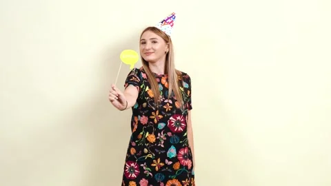 The young mature dances while holding a sticker with the inscription zzzzzz Stock-Footage 141669546