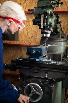 Young Mechanic Apprentice On Milling Machine 스톡 사진