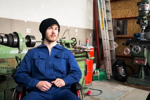 Young Mechanic / Apprentice In A Workshop Stock Photos