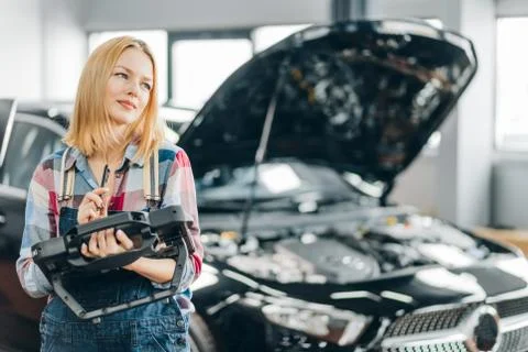Young mechanic working with a tool Stock Photos