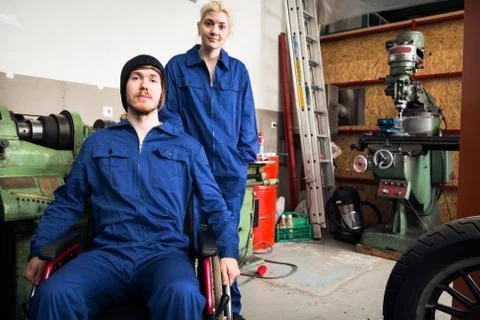 Young Mechanics Apprentices In A Workshop 스톡 사진
