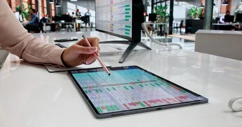 Young Medical Billing Coder Reviews Data On Computer During Busy Office Day. Stock Photos