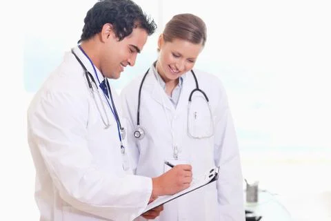 Young medical staff working on patient record Stock Photos