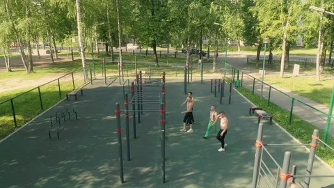 Young men are doing handstand on bars at workout outdoors Video stock 92305115
