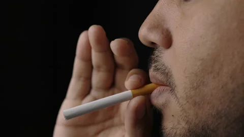 Young men are going to smoke He put a cigarette in his mouth. World No Tobacco D Stock Footage 152765286