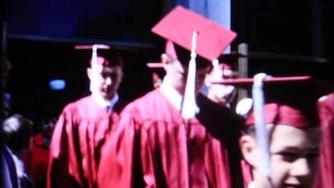 Young men in cap and gown ready for graduation 1950 vintage film home movie 4456 Stock Footage