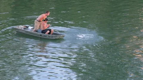 Young Men Catch a Fish Stockbeeldmateriaal 10827754