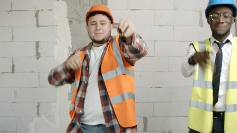 Young men dancing on construction site Stock Footage 125454891