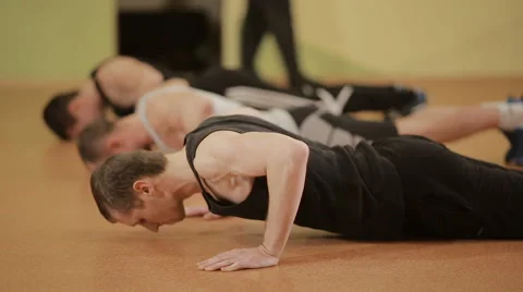 Young men doing push ups on the limit Stock Footage 60427959
