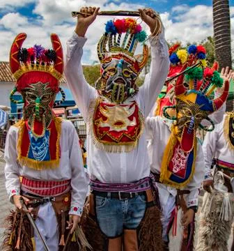 Young men dressed in Devil masks for an Ecuadorian parade Stock Photos