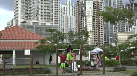 Young men excersise on La Cinta Costera, Panama City, Panama Stock Footage 47898875