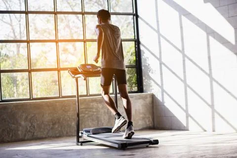 Young men exercise on an automatic treadmill 스톡 사진