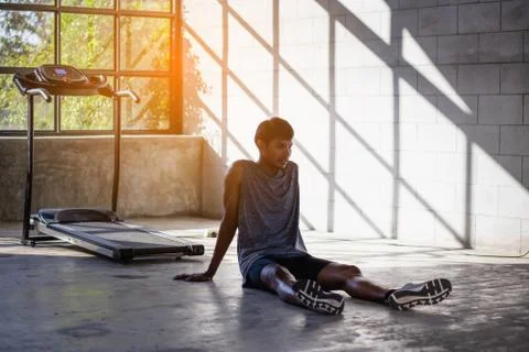 Young men exercise on an automatic treadmill Stock Photos