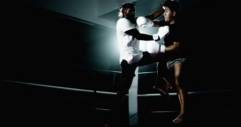 Young men fighting inside boxing ring, i... | Stock Video | Pond5