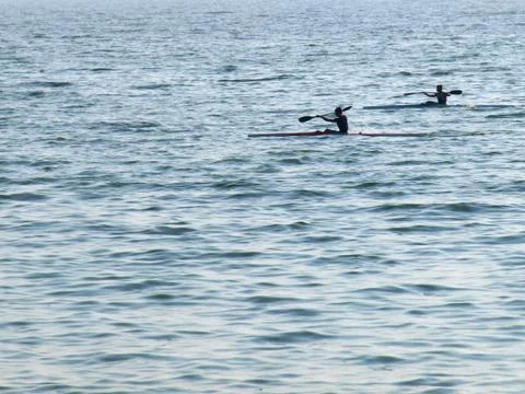 Young men float on the kayaking Stock Photos