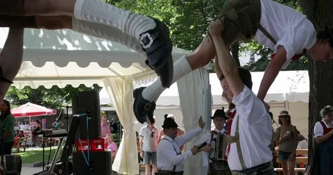 Young men folk dancing in Tirol costumes, Austria Stock Footage 79682611