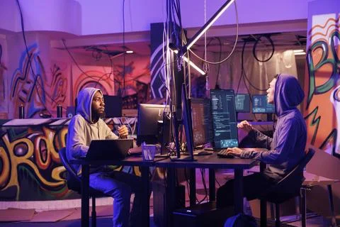 Young men hacking network system 스톡 사진