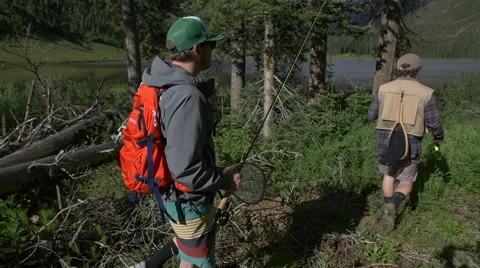 Young men hike to fly fish Stock Footage 56563902