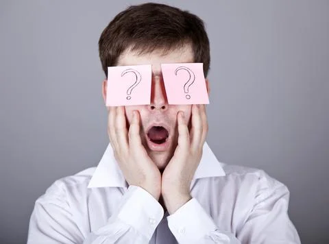 Young men with notes on eyes. Stock Photos