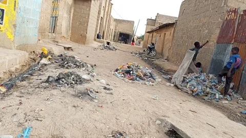 Young Men Packing Plastic Bottles For Recycling Kano Nigeria Stockbeeldmateriaal 330596800