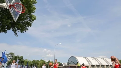 Young men playing basketball Stock Footage 71751007