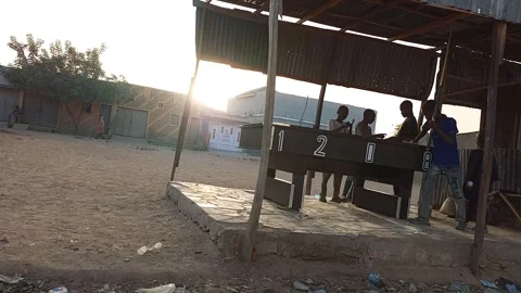 Young Men Playing Snooker At Sunset Ungogo Kano Nigeria Stockbeeldmateriaal 329680408