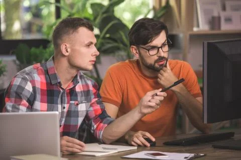 Young men programmers working together in the office 스톡 사진