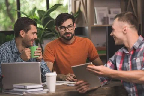 Young men programmers working together in the office Stock Photos
