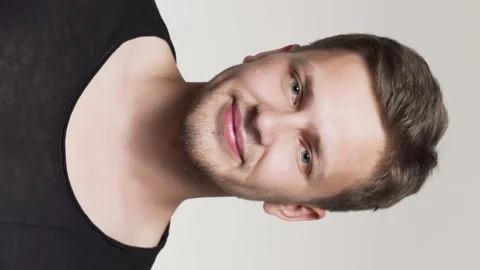 Young men smiling at camera vertical close up shot Stock Footage 205181796