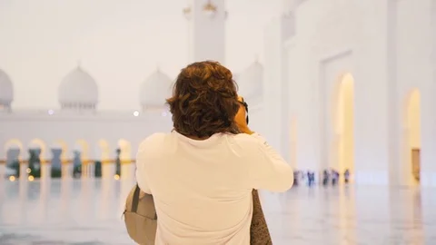 Young men taking a picture at mosque Stock Footage 91508821