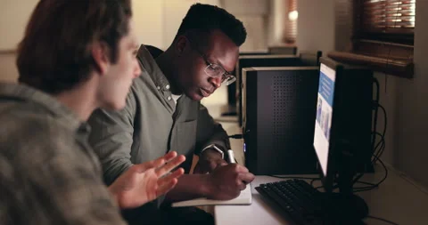 Young men, teamwork and computer or writ... | Stock Video | Pond5