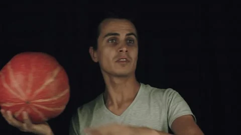 Young men throw pumpkin slowmotion Stock Footage 68185246