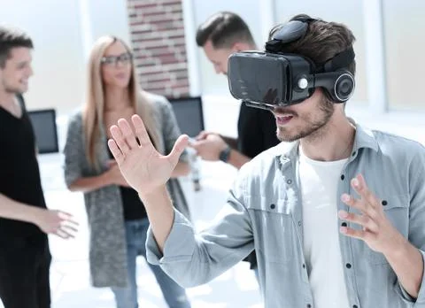Young men with virtual reality goggles Stock Photos
