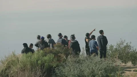 Young men watch SpaceX launch near Vandenberg Air Force Base Video stock 143674953