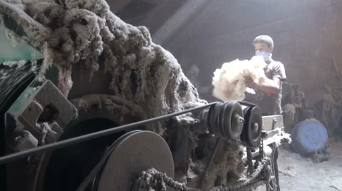 Young men work in poorly lit cotton factory in Central Asia Stock-Footage 28490626