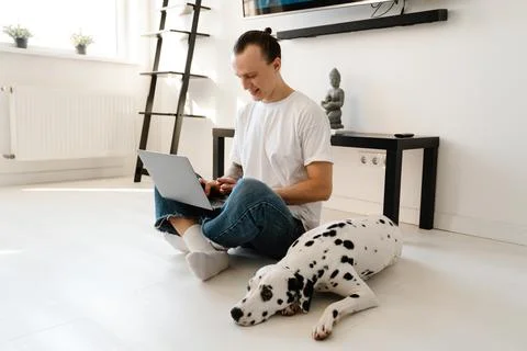 Young mid aged man working on laptop computer Stock Photos