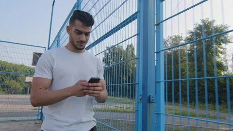 Young Middle eastern Arabic athlete in summer sportswear walking moving along Stock Footage 161914463