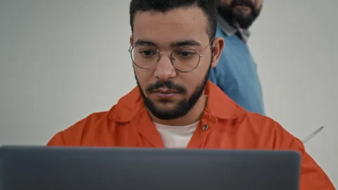 Young Middle Eastern Male Convict Working on Coding Project in Prison 스톡 동영상 314054471