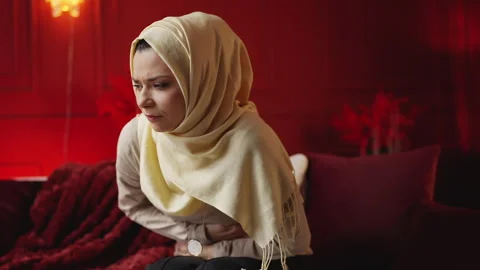 Young Middle Eastern woman feels sharp abdominal pain, suffering health problem Stock-Footage 343985465