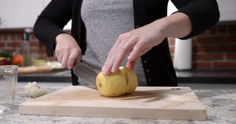 Young millennial cutting a lemon Stock Footage 98193164